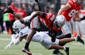 Sayin melakukan 4 touchdown, peringkat teratas Ohio State mengambil kendali di babak kedua dan menang 38-14 atas Penn State