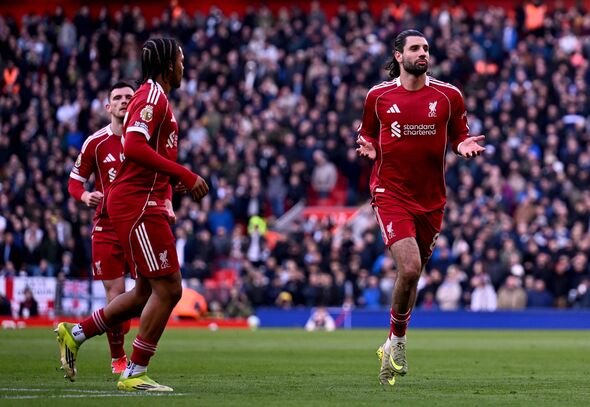 Dominik Szoboszlai merayakan golnya untuk Liverpool melawan Tottenham.