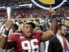 Jaksa mengatakan riasan dan wig membantu mantan pemain Alabama itu menyamar sebagai pemain NFL dalam penipuan senilai $20 juta