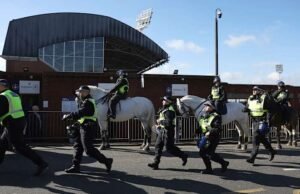 Millwall marah setelah brosur anti-rasisme menunjukkan lencana jubah Ku Klux Klan